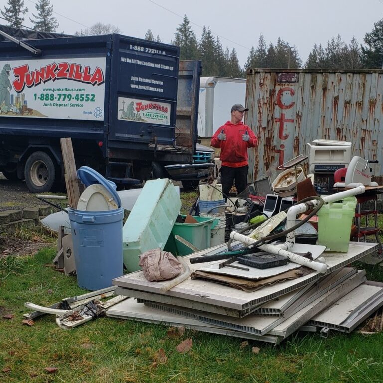 Man standing with waste removal service surrounded by junk and debris