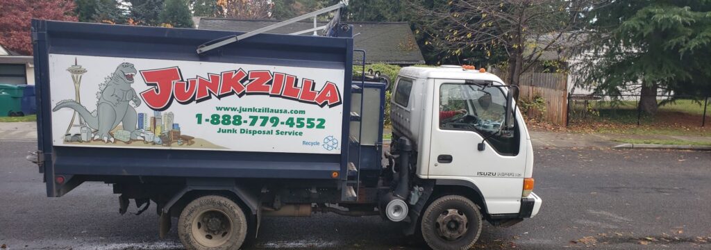 Junk removal truck with company logo and contact information